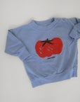 Ljusblå sweatshirt från Bobo Choses i modell Tomato.